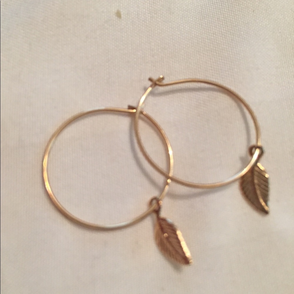 Mini gold-filled hoops with leaf charm from Etsy